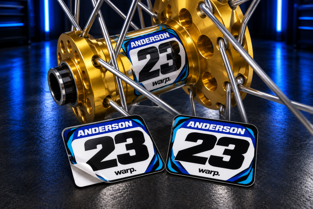 Anderson 23 custom hub decals shown flat and installed on a gold motocross wheel hub; hub not included