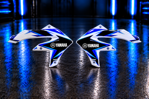 Pair of custom blue, cyan, black and white radiator shroud decals with Yamaha and WARP example logos; plastic shrouds not included