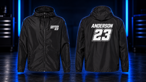 Black Rider ID windbreaker, front and back, with sample Anderson 23 printed vinyl in the blue-lit WARP workshop