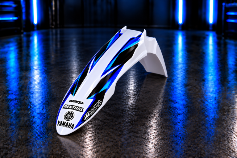 Custom front fender decals on an Acerbis-style Yamaha fender with Yamaha, Renthal, WARP and Maxima sample logos; decals only, plastic not included